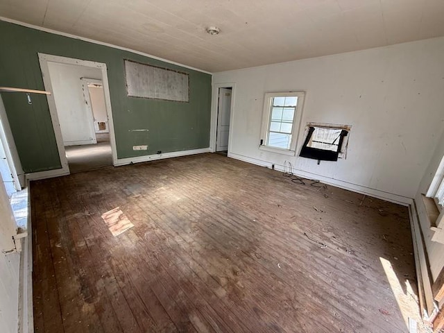 504 E 8th St, Portageville, MO 63873 - unfurnished living room with wood-type flooring and ornamental molding