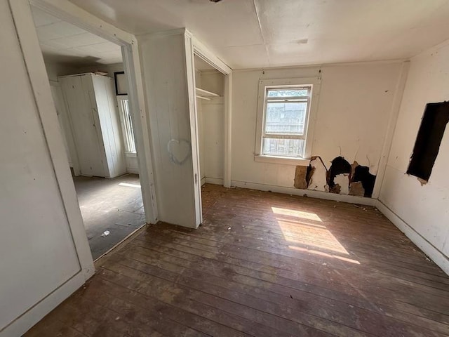 504 E 8th St, Portageville, MO 63873 - unfurnished bedroom featuring hardwood / wood-style floors and a closet