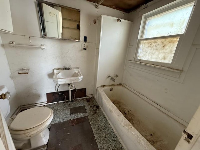 504 E 8th St, Portageville, MO 63873 - full bath featuring toilet, a sink, and bathtub / shower combination