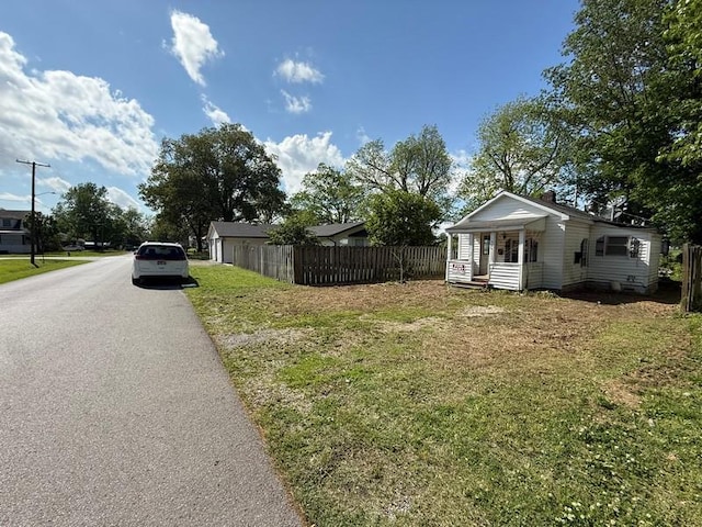 504 E 8th St, Portageville, MO 63873 - view of yard with asphalt driveway
