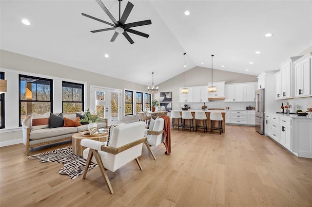 973 Buckner Rd, Wentzville, MO 63385 - living room with high vaulted ceiling, ceiling fan, light wood-type flooring, a chandelier, and recessed lighting