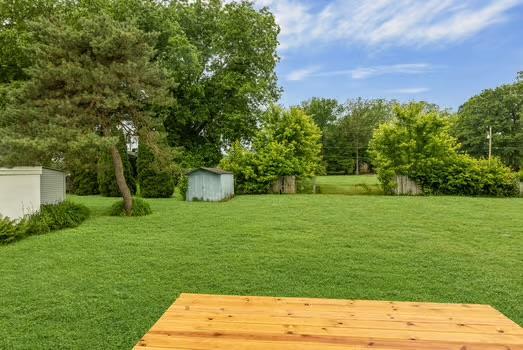 121 Douglas St, Ofallon, IL 62269 - view of grassy yard with a wooden deck