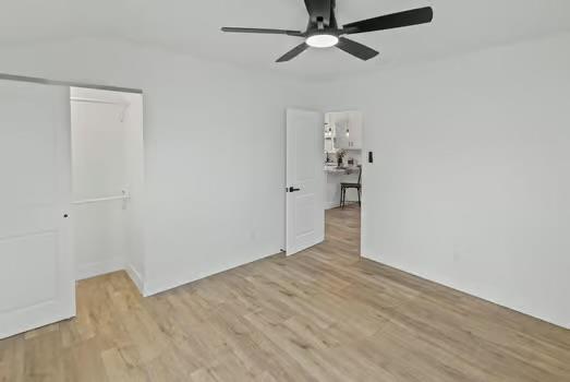121 Douglas St, Ofallon, IL 62269 - unfurnished room with a ceiling fan and light wood-type flooring