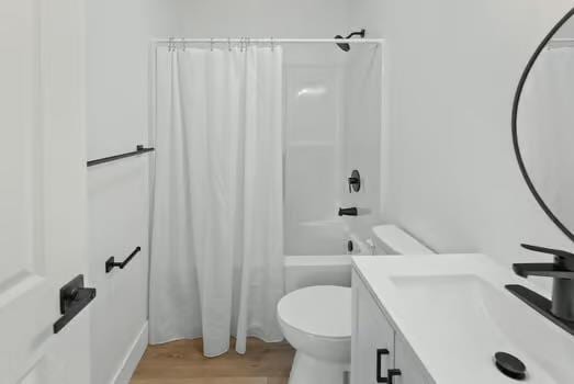 121 Douglas St, Ofallon, IL 62269 - full bath featuring toilet, wood finished floors, shower / bath combo with shower curtain, and vanity