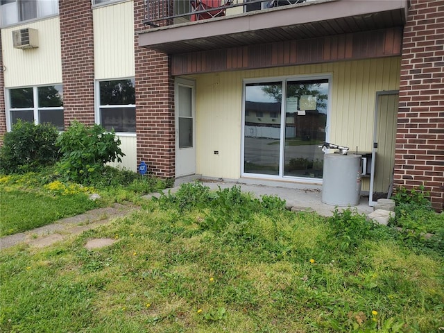 7445 Hazelcrest Dr Unit B, Hazelwood, MO 63042 - doorway to property with brick siding and a balcony
