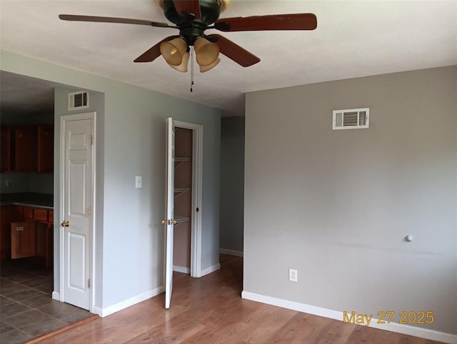3734 Carol Park Rd, House Springs, MO 63051 - unfurnished room with ceiling fan, baseboards, and dark wood-type flooring