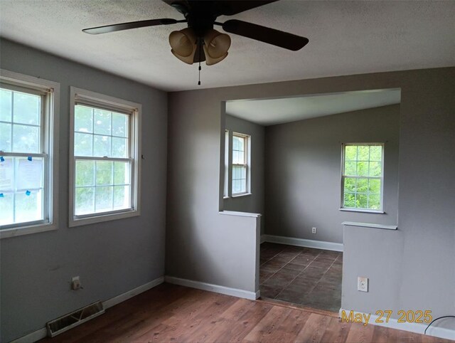 3734 Carol Park Rd, House Springs, MO 63051 - empty room with ceiling fan, a textured ceiling, wood finished floors, and baseboards