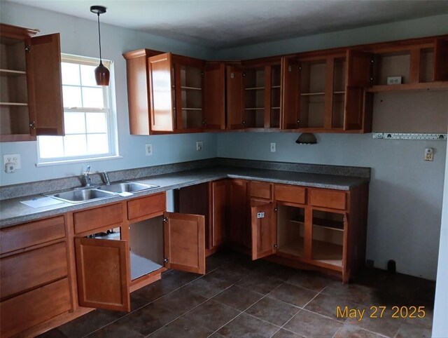 3734 Carol Park Rd, House Springs, MO 63051 - kitchen featuring open shelves, a sink, brown cabinets, pendant lighting, and dark tile patterned floors