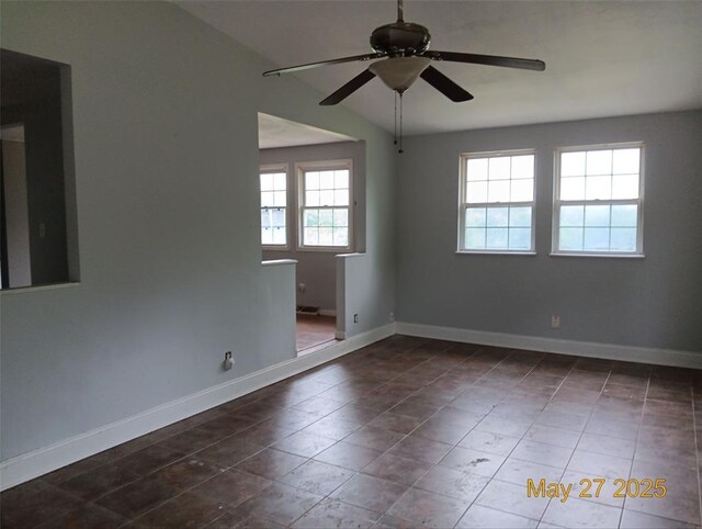 3734 Carol Park Rd, House Springs, MO 63051 - unfurnished room with ceiling fan, baseboards, and dark tile patterned flooring