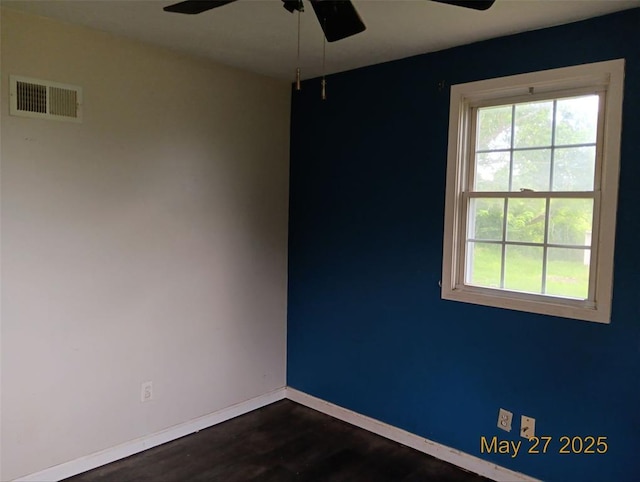 3734 Carol Park Rd, House Springs, MO 63051 - unfurnished room with ceiling fan, healthy amount of natural light, dark wood-type flooring, and baseboards