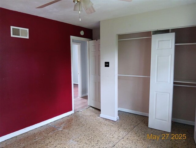 3734 Carol Park Rd, House Springs, MO 63051 - unfurnished bedroom with baseboards, speckle patterned floor, a closet, and a ceiling fan
