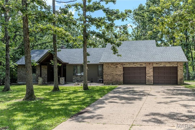 700 Lariat Ln, Rolla, MO 65401 - view of front of home with a garage, roof with shingles, driveway, a front lawn, and brick siding