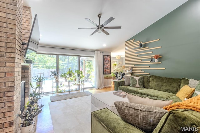 700 Lariat Ln, Rolla, MO 65401 - living room with ceiling fan, lofted ceiling, wood finished floors, and a fireplace