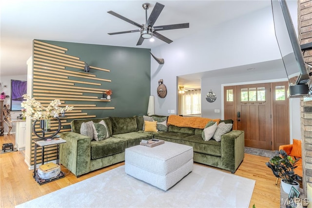 700 Lariat Ln, Rolla, MO 65401 - living area with a ceiling fan, wood finished floors, and high vaulted ceiling