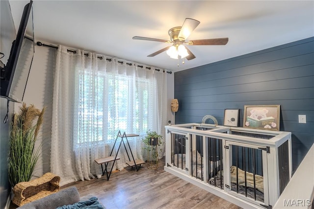 700 Lariat Ln, Rolla, MO 65401 - bedroom with wood finished floors, a nursery area, and ceiling fan