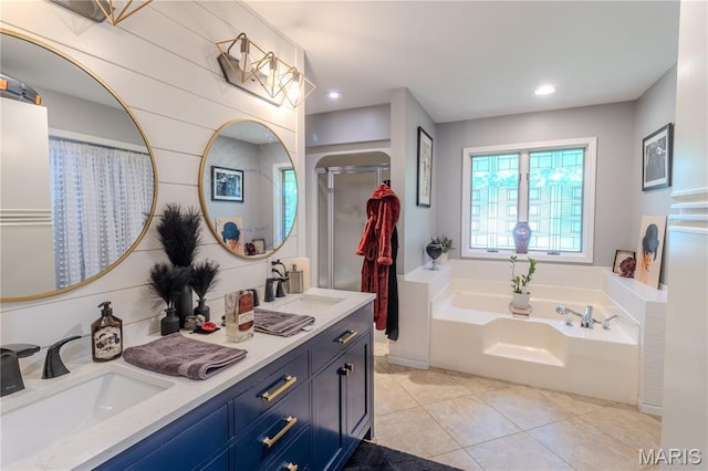 700 Lariat Ln, Rolla, MO 65401 - full bathroom featuring double vanity, a bath, tile patterned flooring, recessed lighting, and a shower with shower curtain