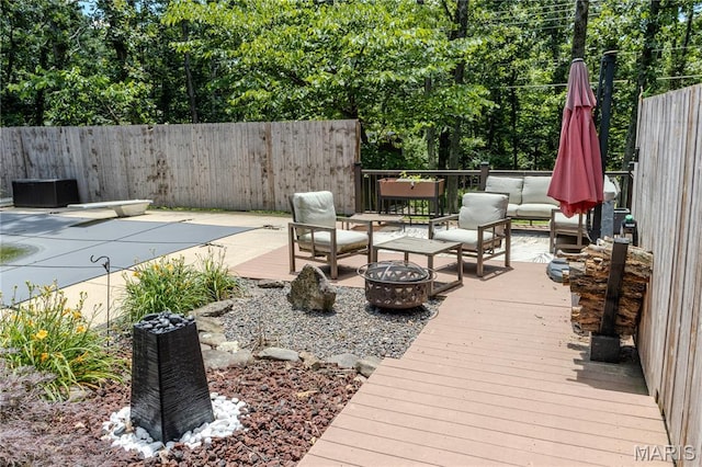 700 Lariat Ln, Rolla, MO 65401 - deck featuring an outdoor living space with a fire pit