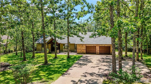 700 Lariat Ln, Rolla, MO 65401 - view of front of property with an attached garage, concrete driveway, a front yard, and a shingled roof