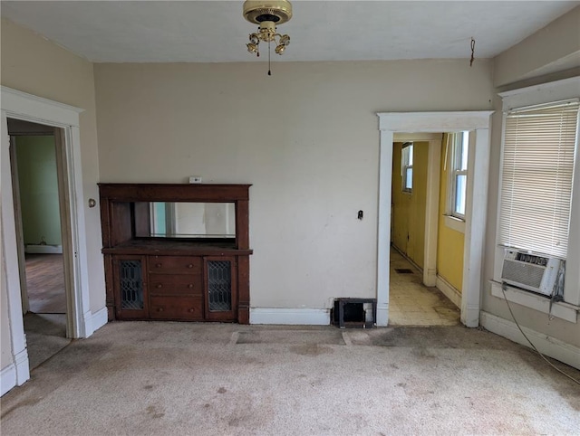115 W Maple St, Gillespie, IL 62033 - unfurnished living room featuring cooling unit, carpet flooring, and baseboards