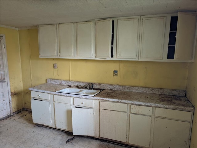 115 W Maple St, Gillespie, IL 62033 - kitchen with a sink, light flooring, light countertops, and open shelves