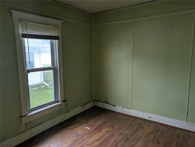 115 W Maple St, Gillespie, IL 62033 - spare room featuring dark wood-style floors and baseboards