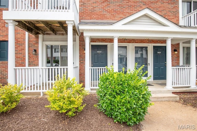 1447 Oriole Pl, Brentwood, MO 63144 - property entrance featuring a porch and brick siding