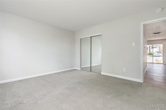 1447 Oriole Pl, Brentwood, MO 63144 - unfurnished bedroom with a closet, carpet, and baseboards