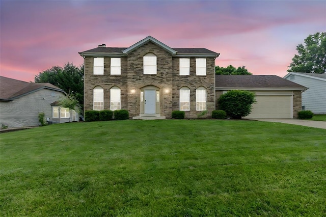 904 Hunter Ln, Lake St Louis, MO 63367 - view of front facade with a yard, an attached garage, and driveway
