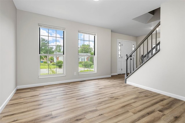 904 Hunter Ln, Lake St Louis, MO 63367 - entryway with baseboards, wood finished floors, and stairway