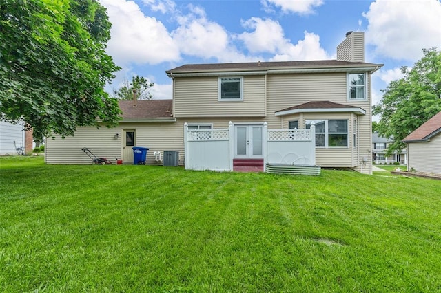 904 Hunter Ln, Lake St Louis, MO 63367 - back of property with a chimney, central air condition unit, and a lawn