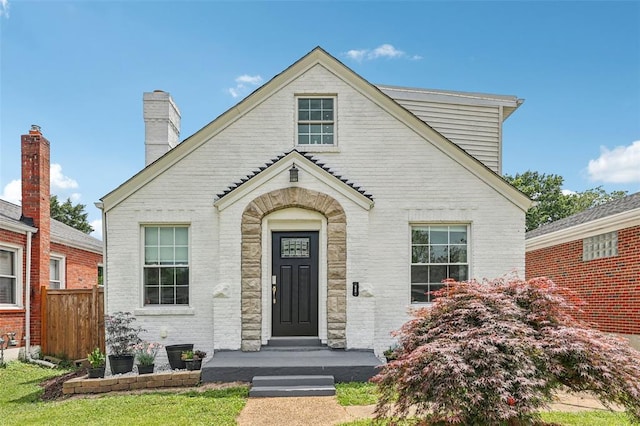 6708 Etzel Ave, University City, MO 63130 - view of front of property with brick siding and a chimney