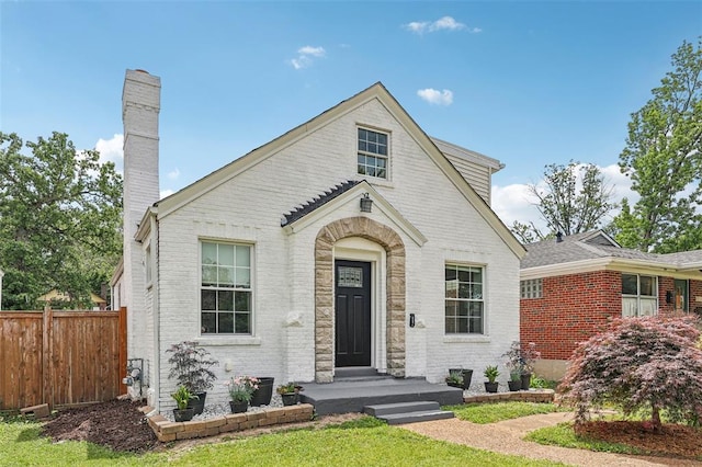 6708 Etzel Ave, University City, MO 63130 - view of front of property featuring brick siding and a chimney