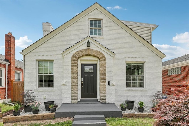 6708 Etzel Ave, University City, MO 63130 - view of front facade featuring brick siding and a chimney