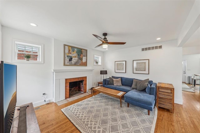 6708 Etzel Ave, University City, MO 63130 - living area with ceiling fan, a fireplace, light wood-type flooring, recessed lighting, and baseboards