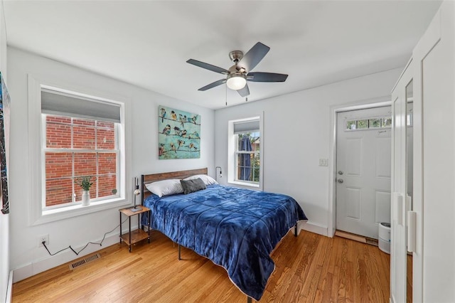 6708 Etzel Ave, University City, MO 63130 - bedroom featuring light wood-style flooring, baseboards, and ceiling fan