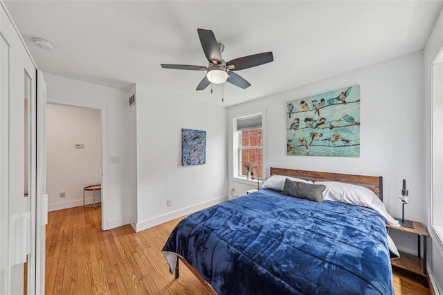 6708 Etzel Ave, University City, MO 63130 - bedroom featuring light wood-style floors, ceiling fan, and baseboards