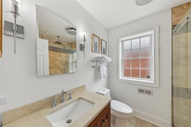 6708 Etzel Ave, University City, MO 63130 - bathroom featuring vanity, a shower stall, toilet, and tile patterned flooring