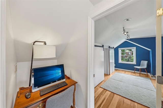 6708 Etzel Ave, University City, MO 63130 - office with vaulted ceiling, wood finished floors, baseboards, and a barn door
