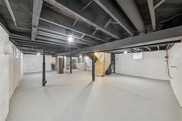 6708 Etzel Ave, University City, MO 63130 - basement with stairway, washer / dryer, and water heater