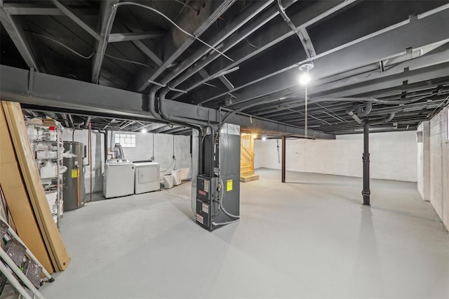 6708 Etzel Ave, University City, MO 63130 - basement featuring independent washer and dryer, water heater, and heating unit