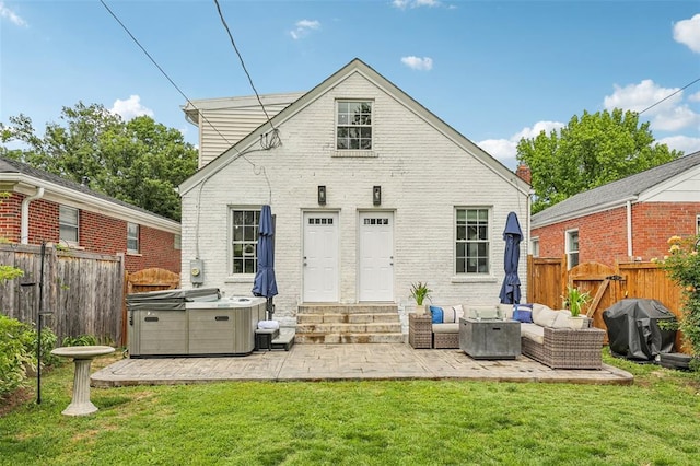 6708 Etzel Ave, University City, MO 63130 - back of house with entry steps, a hot tub, a patio, brick siding, and outdoor lounge area