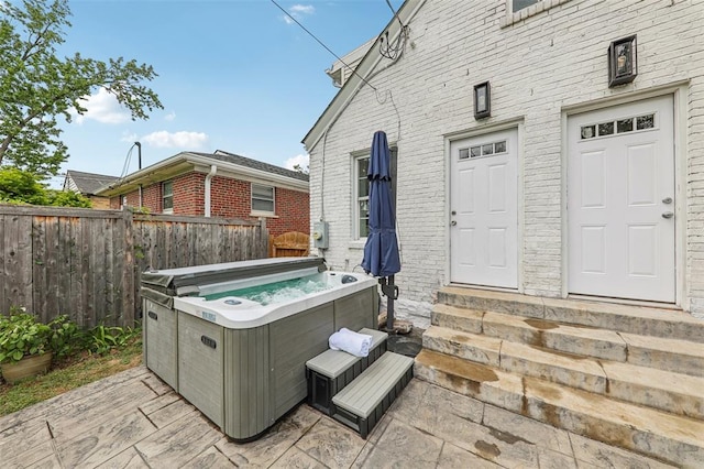 6708 Etzel Ave, University City, MO 63130 - view of patio with a hot tub and entry steps