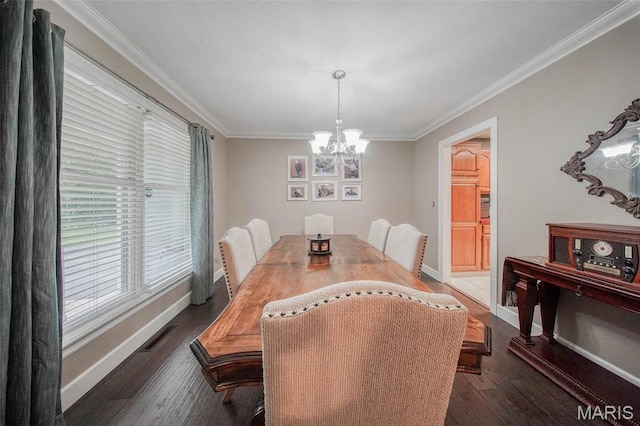 1708 Line Ave, Rolla, MO 65401 - dining area with a chandelier, ornamental molding, wood finished floors, and baseboards