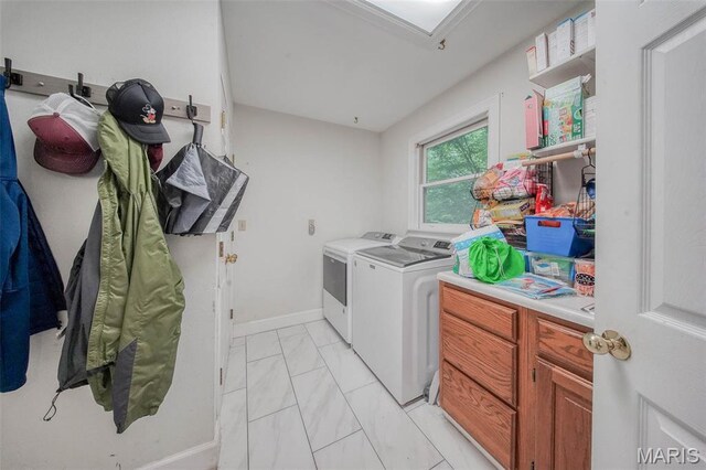 1708 Line Ave, Rolla, MO 65401 - laundry room with washing machine and dryer, light marble finish floors, and baseboards
