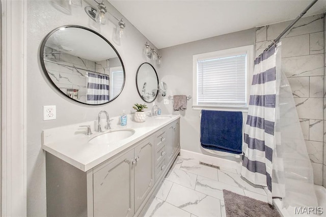 1708 Line Ave, Rolla, MO 65401 - bathroom featuring marble finish floors, double vanity, a shower with curtain, and baseboards
