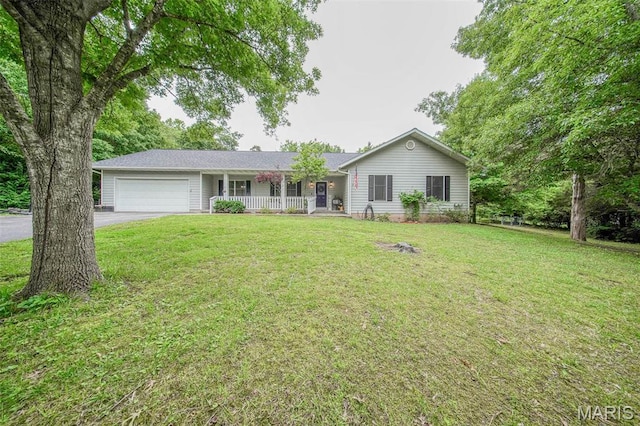1708 Line Ave, Rolla, MO 65401 - single story home featuring a porch, a garage, driveway, and a front lawn
