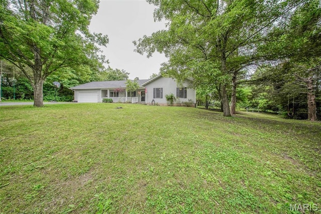 1708 Line Ave, Rolla, MO 65401 - view of green lawn with a garage