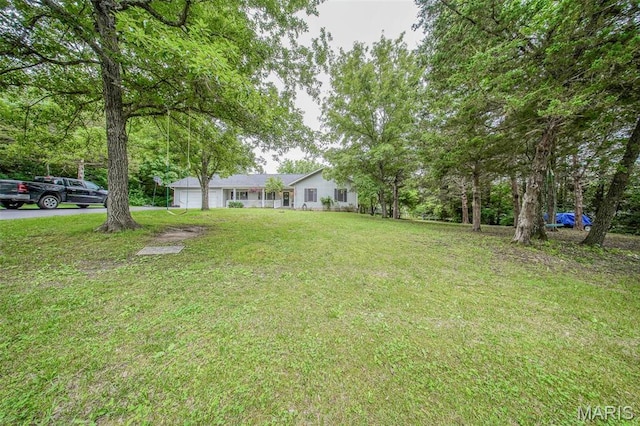 1708 Line Ave, Rolla, MO 65401 - view of grassy yard featuring a garage