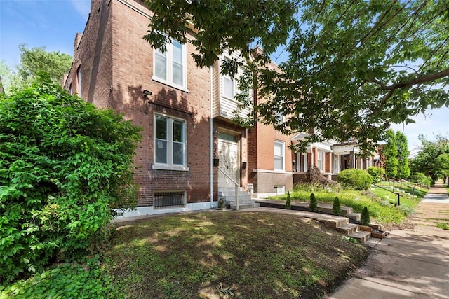 3535 Giles Ave, Saint Louis, MO 63116 - view of property featuring brick siding and entry steps