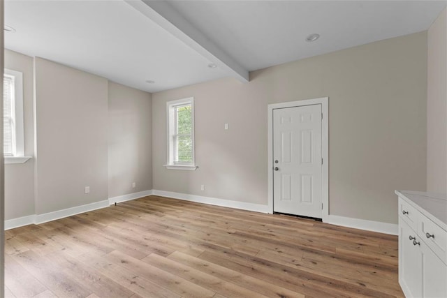 3535 Giles Ave, Saint Louis, MO 63116 - empty room featuring light wood finished floors, baseboards, and beamed ceiling
